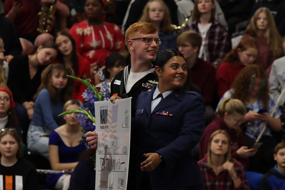 DeBiaso poses for a photo with her recruiter, DC1 Parker Wolfe, PCHS alumnus. 