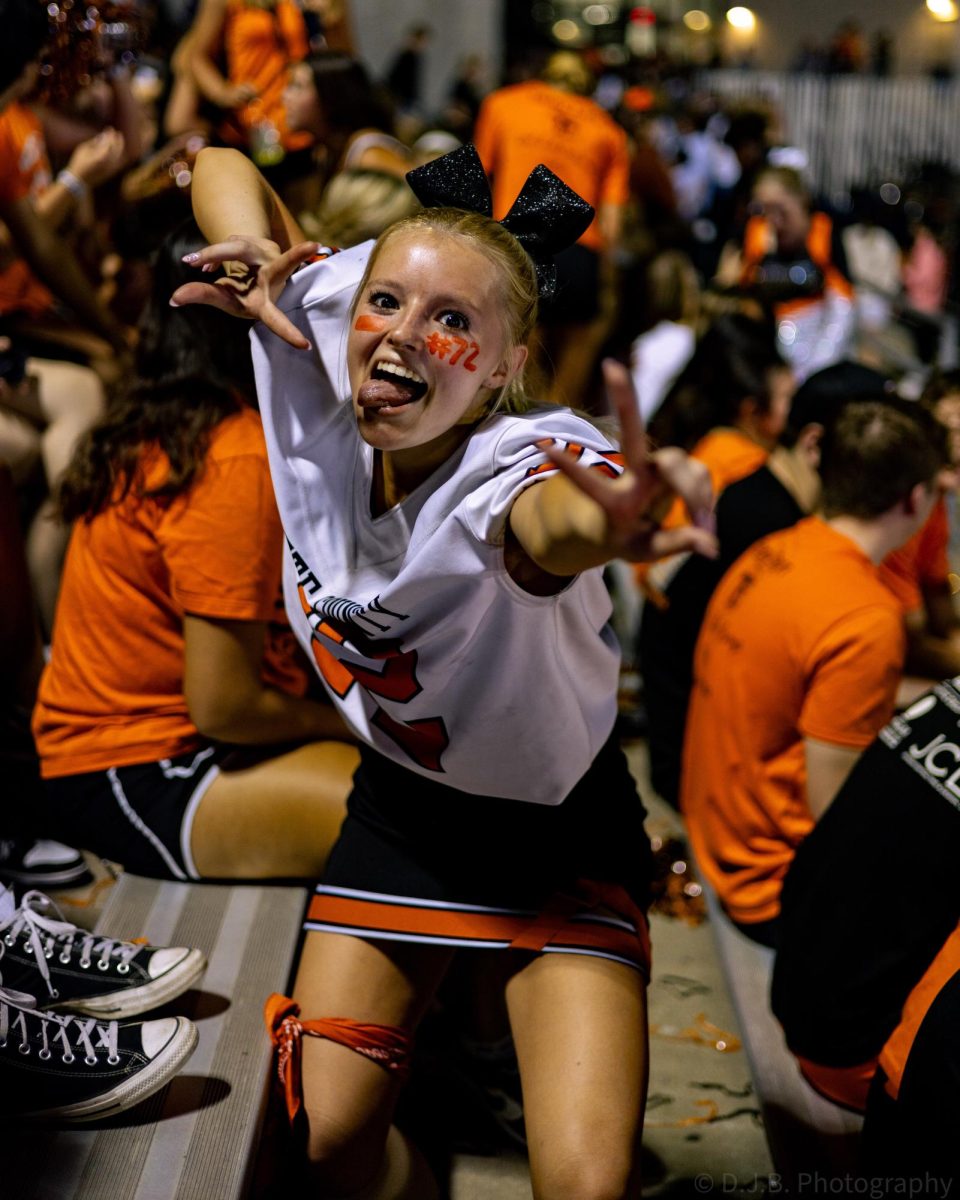 Platte County cheerleader Junior Karrington Friddell  cheers on her team from the stands  