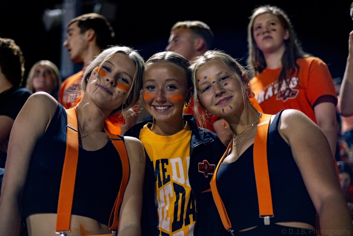 Seniors Breckyn Whitton-Peterson, Rylee Burris, and Freshman Brynna Whitton-Peterson posing for a group photo op