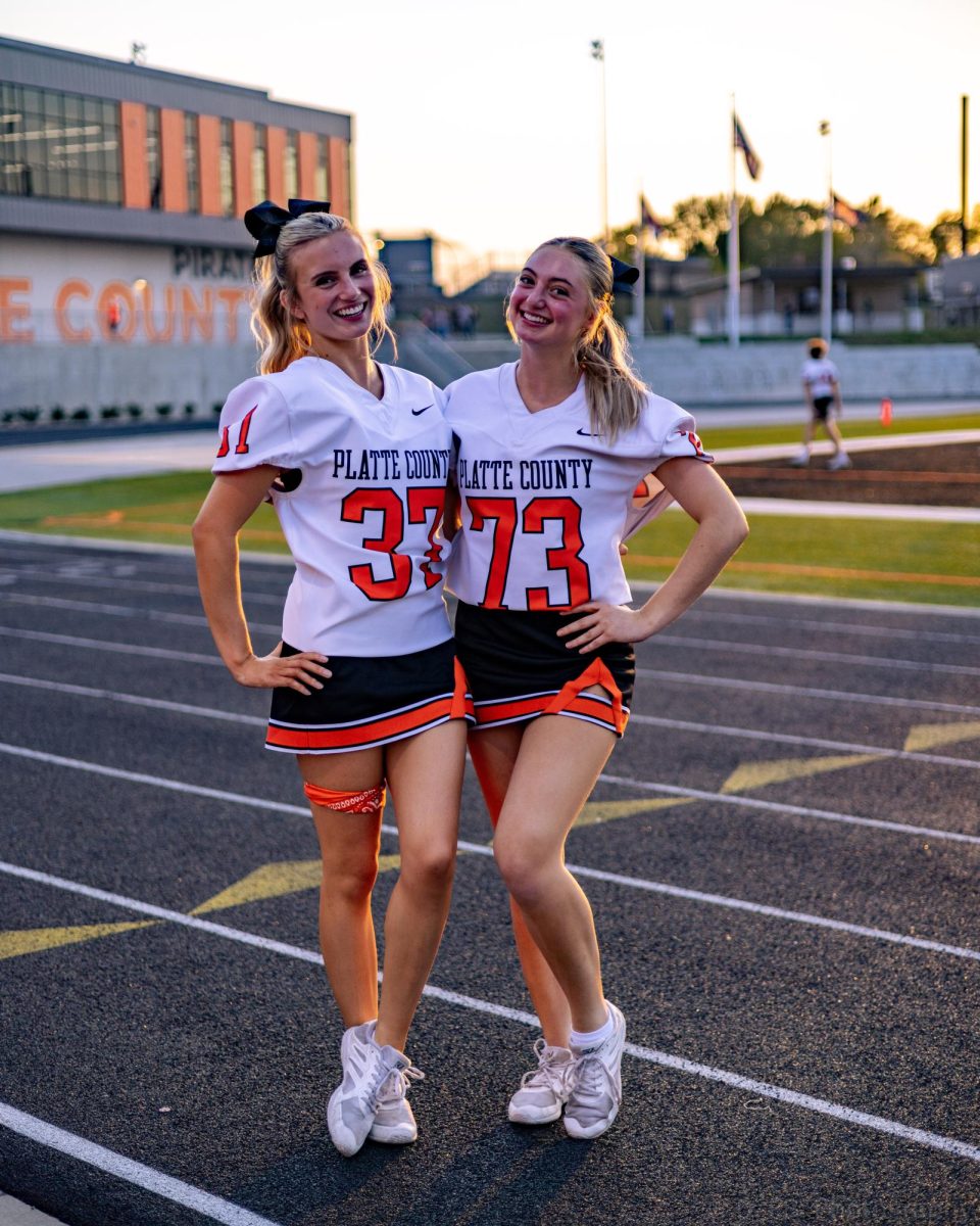 Junior Cheerleaders Saylor Lembke and Sophia Jaffe pose for a photo before the game 