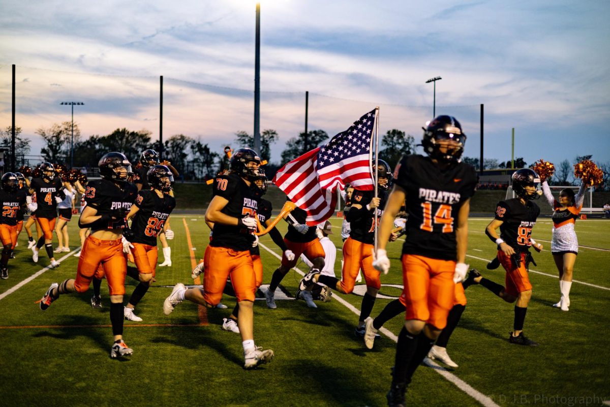 Platte County Football Team runs out on the field for the first quarter.