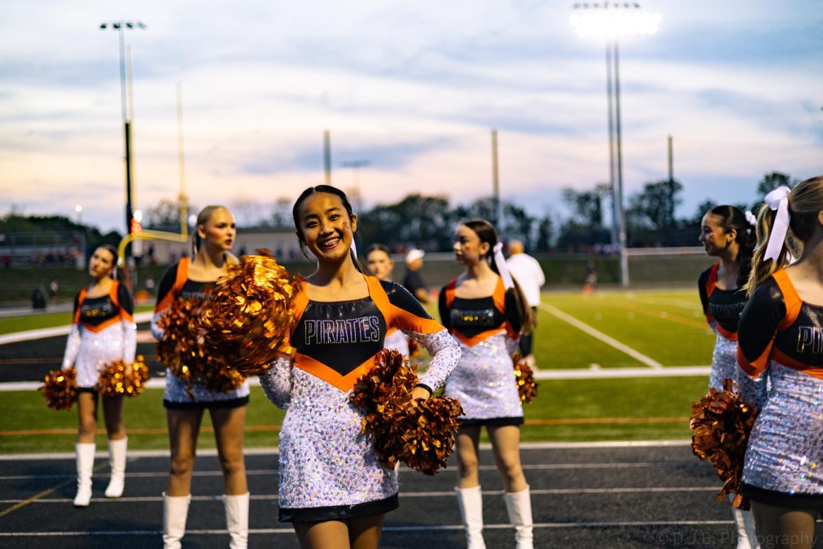 Junior dancer Arin Lee waves at the camera 