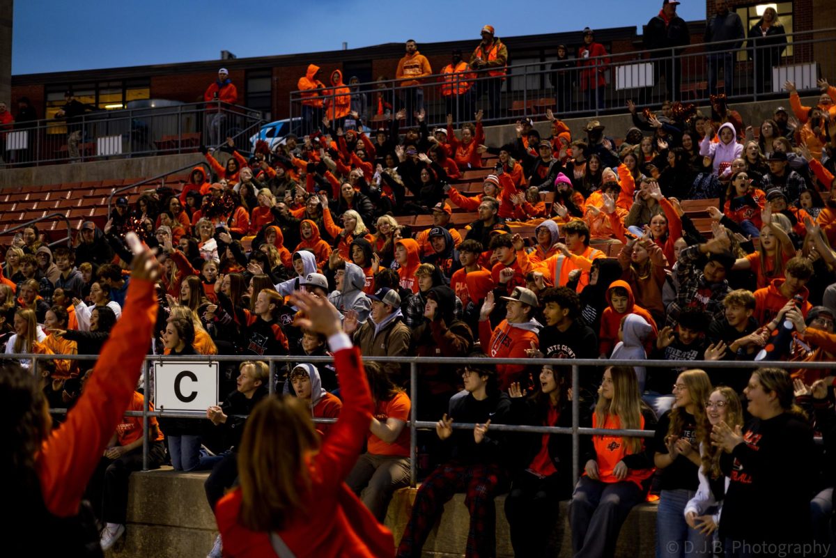 Director of Communications Laura Hulett and Journalism Teacher Devan Foos lead the crowd in a cheer 