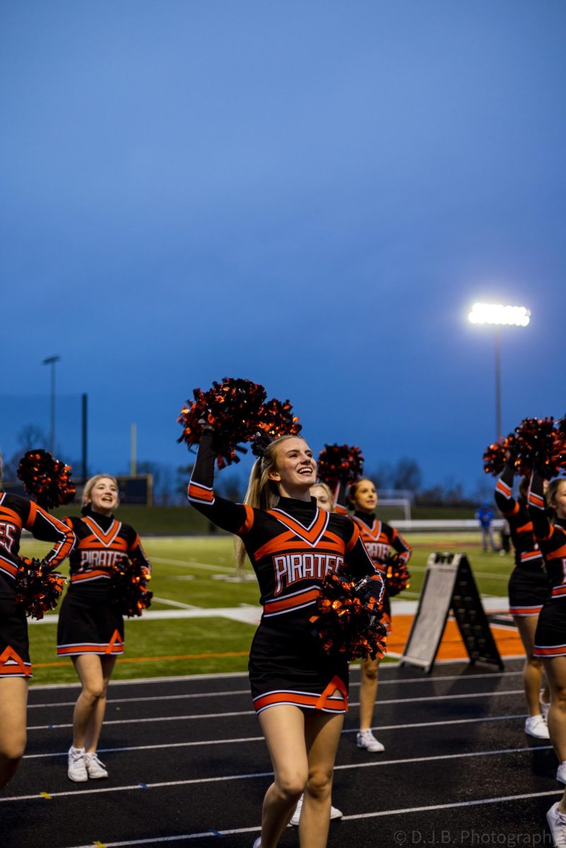 Junior Saylor Lembke cheers for the crowd early in the morning 