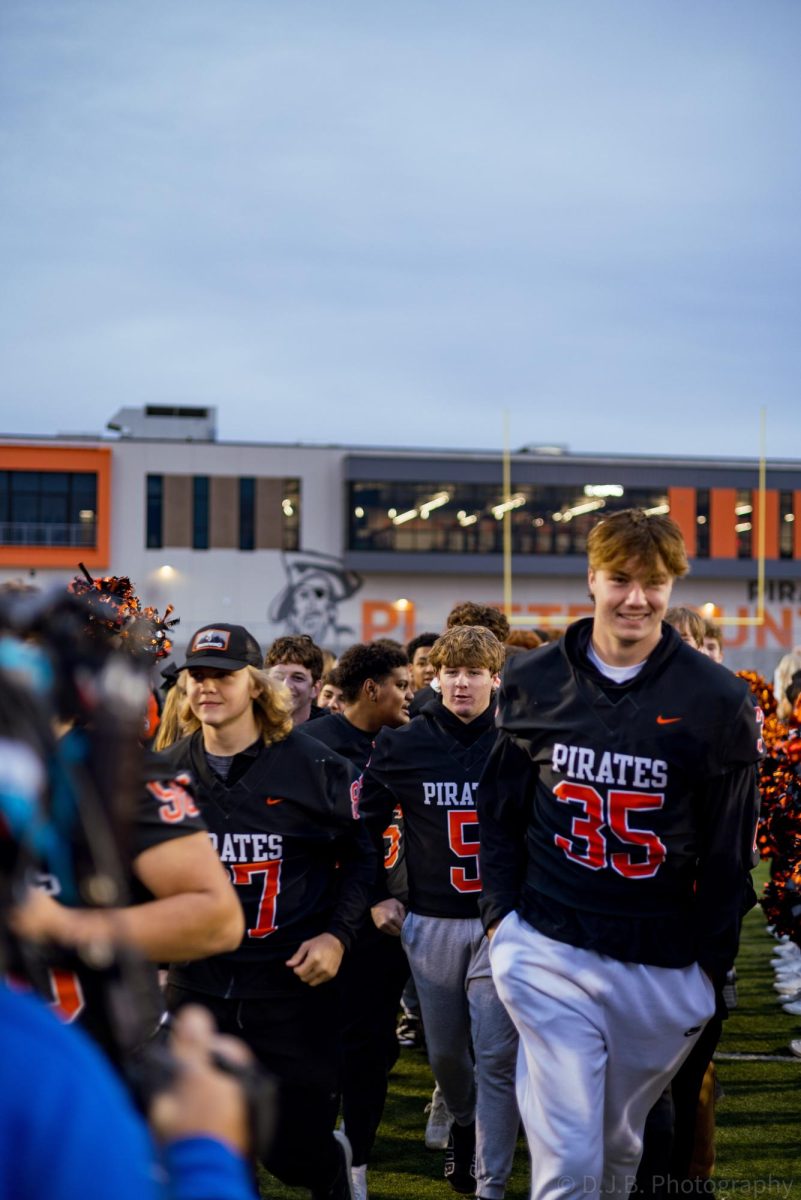 Live on the TODAY Show Junior Jack Utz walks down the aisle formed by the cheerleaders with the rest of the football team  