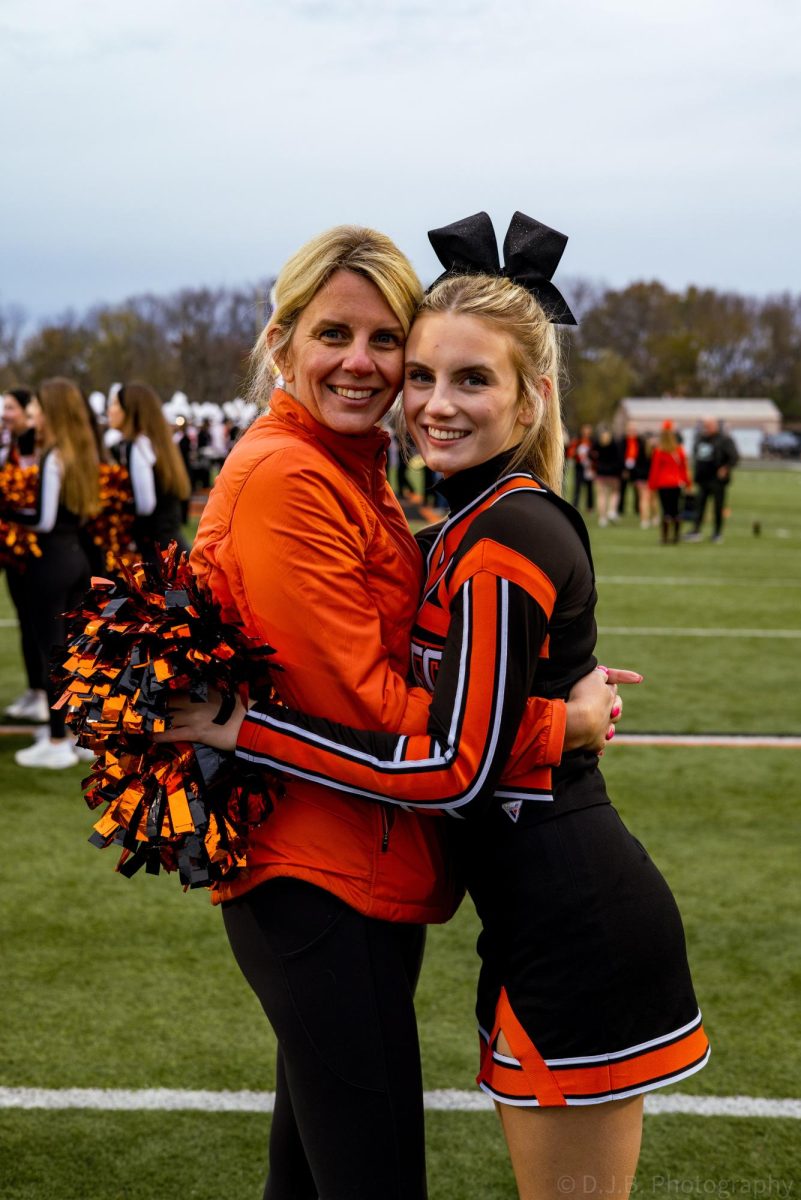 Junior Saylor Lembke hugs her mother after the TODAY Show started to pack up to leave 