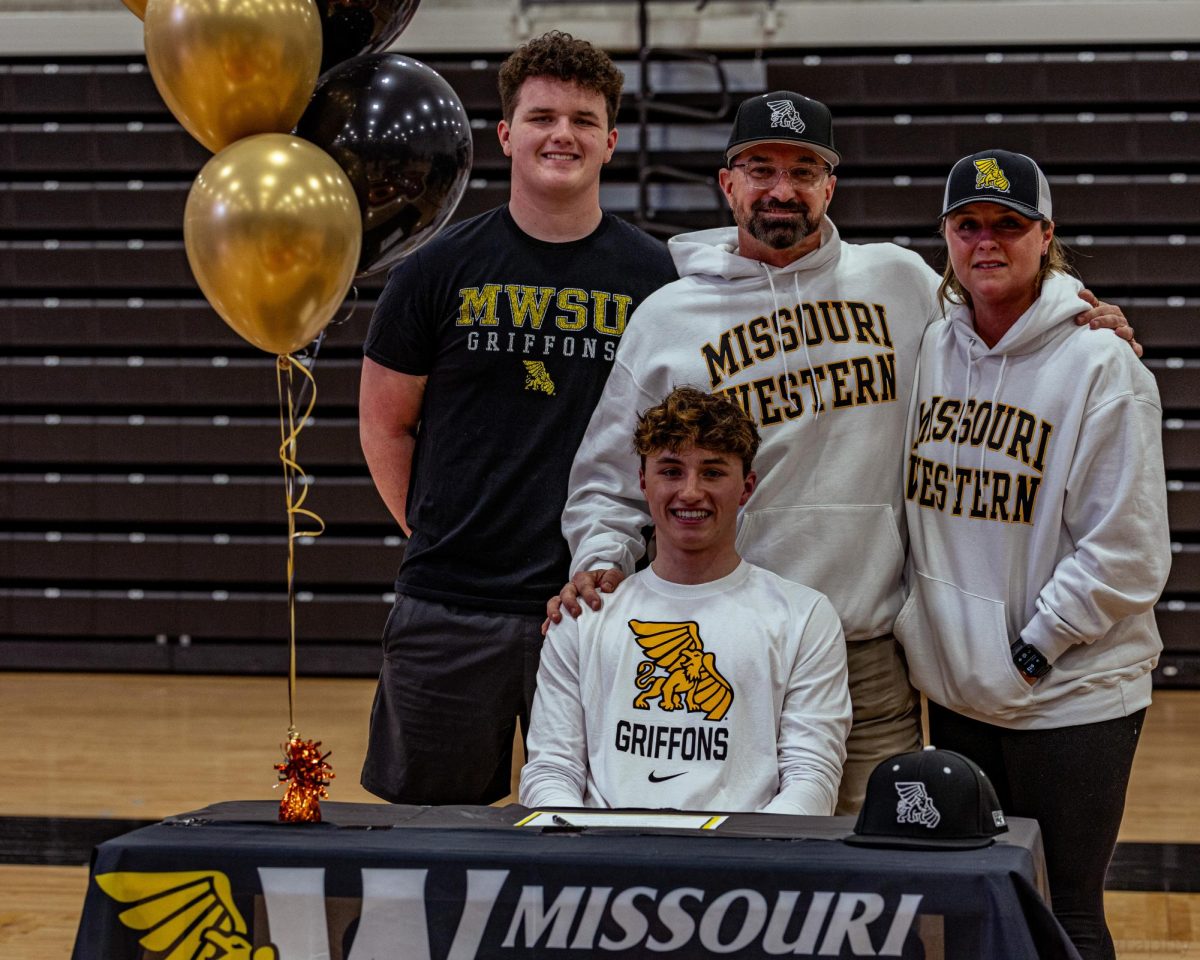 Beaming with pride, Senior center fielder, Bronson Ryan signs with Missouri Western Jan. 29, 2025. 