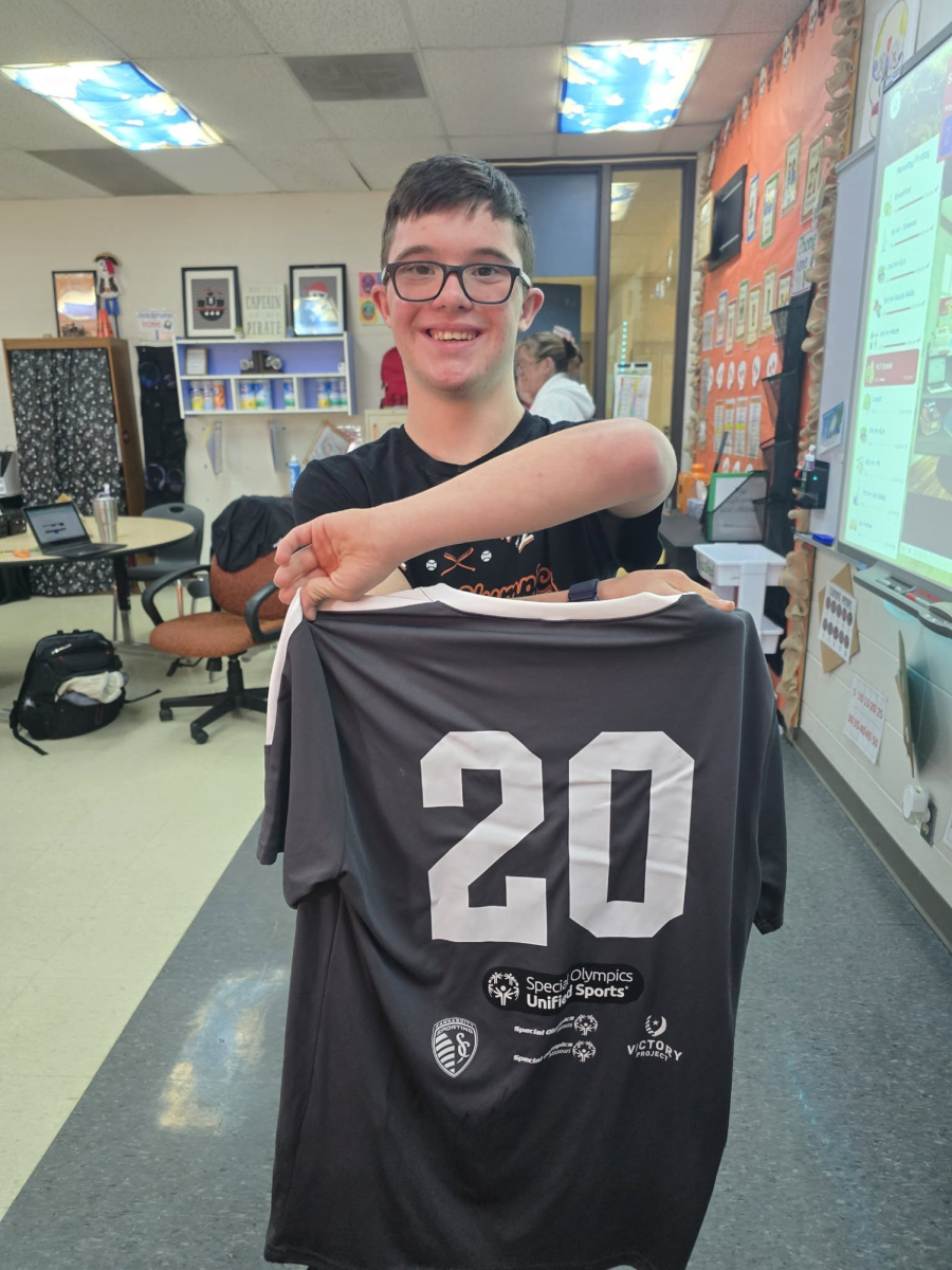 Sophomore Chase Hitchcock shows off his Special Olympics jersey. 