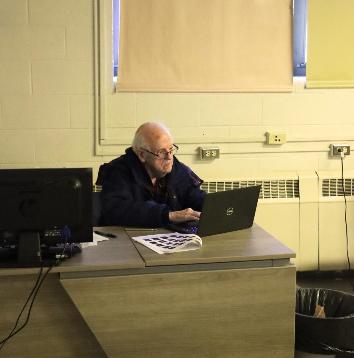 Behind the desk, substitute teacher John Erickson types on his Chromebook while filling in for history teacher Dr. Blake Seifert. Erickson is more commonly known as "Grandpa" among the student body, and is a frequent sub across the district. 