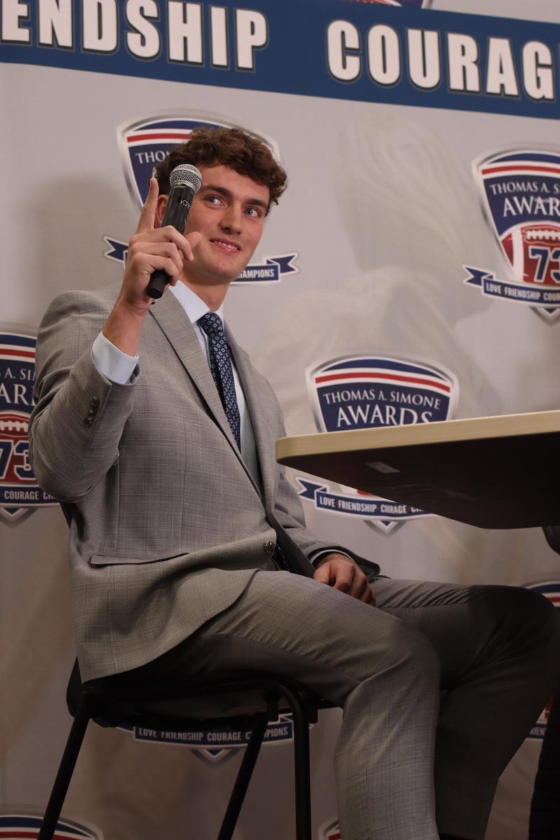 Marriott points to his teammates to thank them during his interview with Shaffer.