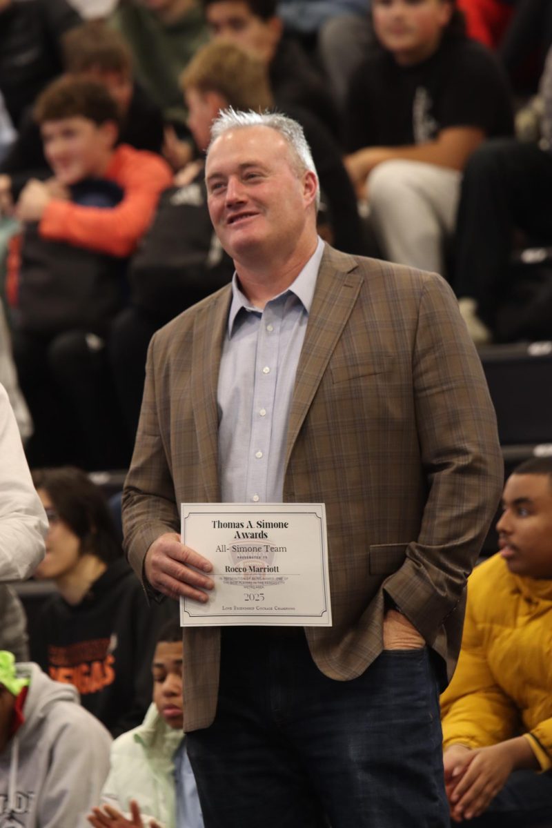 Jeff Marriott, dad of senior Rocco Marriott accepted his son's All-Simone Team roster nomination.